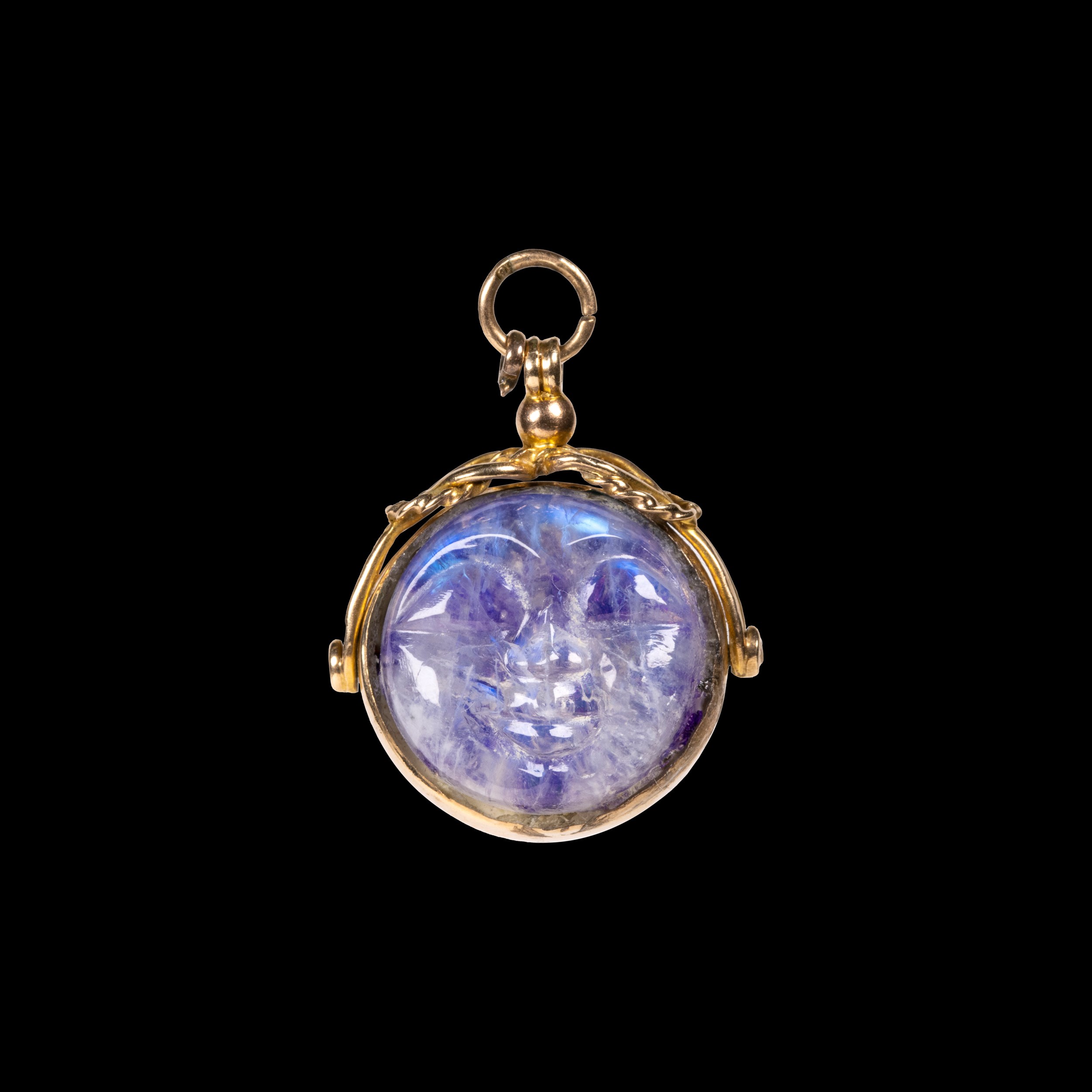 A 1920 gold and labradorite swivel pendant. Man in the moon